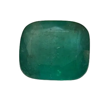 Green gemstone on a white stone with a yellow background
